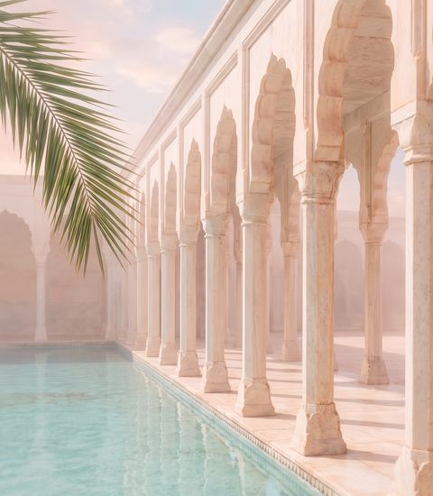 A marble colonnade beside turquoise water